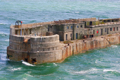 View of sea with buildings in background