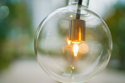 Close-up of illuminated light bulb