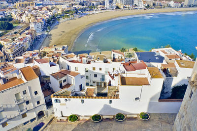 High angle view of city by sea