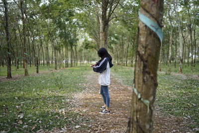 Full length of man walking in forest