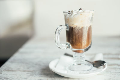 Close-up of coffee in glass on table