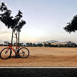 Bicycle on road against sky