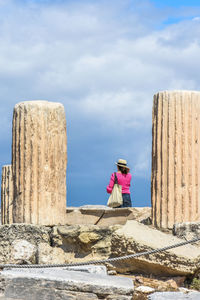 Woman standing against sky