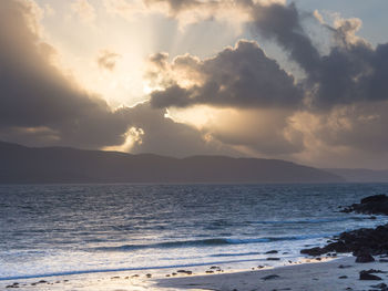 Scenic view of sea against cloudy sky