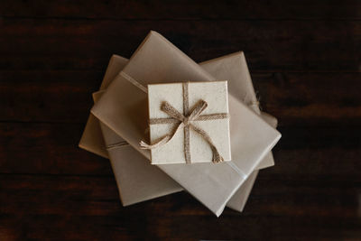 Top view stack of many xmas gift boxes wrapped in recycled kraft paper. eco-friendly, sustainable, 