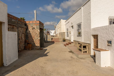Footpath amidst buildings in town