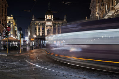 Light trails on street in city at night