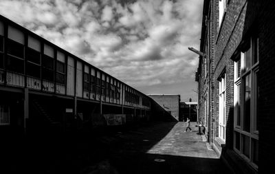 Street amidst buildings in city against sky