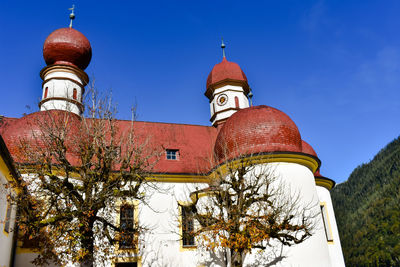 Low angle view of traditional building against blue sky