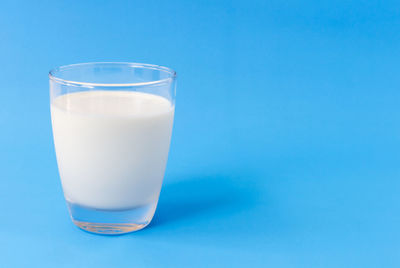 Close-up of drink against blue background