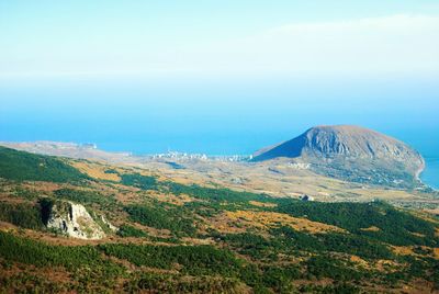 Scenic view of mountain against blue sky