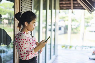 Young woman using mobile phone