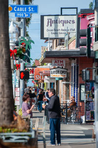 People walking on street in city