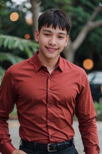 Portrait of young man standing outdoors