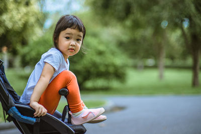 Portrait of cute girl riding bicycle