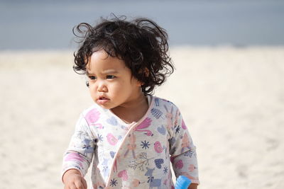 Close-up of cute girl on beach