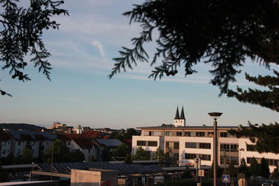 Buildings in town against sky