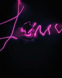 Close-up of light painting against black background