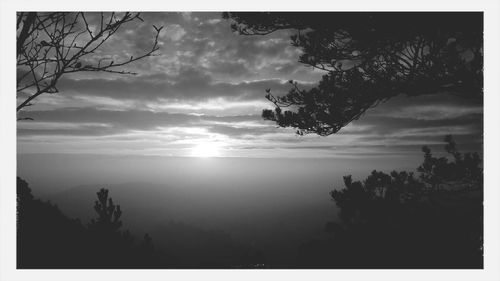 Scenic view of landscape against cloudy sky