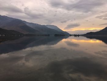 Scenic view of lake against sky during sunset