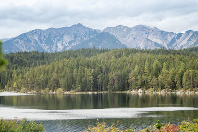 Scenic view of lake and mountains against sky