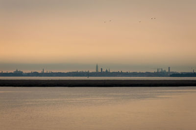 Scenic view of sea at sunset