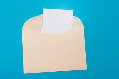 Close-up of paper against blue background