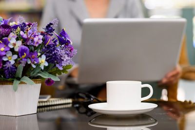 Close-up of purple and white flowers on table
