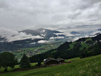 Scenic view of landscape against cloudy sky