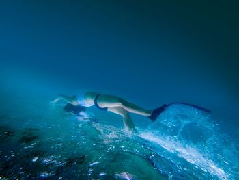 Woman swimming in sea