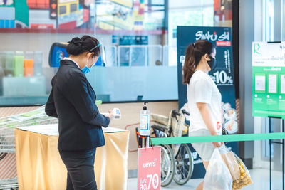 Full length of woman standing in store