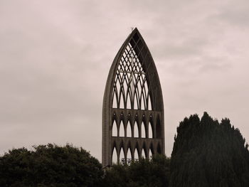 Low angle view of historic building against cloudy sky