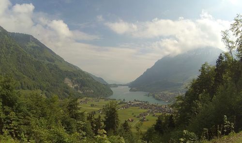 Scenic view of mountains against cloudy sky