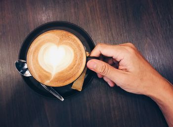 High angle view of coffee cup on table