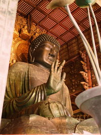 Low angle view of buddha statue in temple