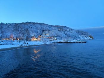 Scenic view of sea against clear blue sky