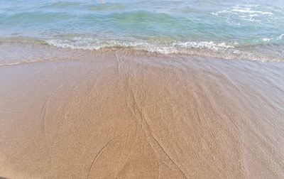 High angle view of surf on beach