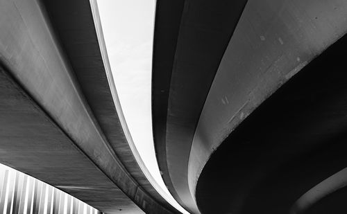 Low angle view of bridge against modern building