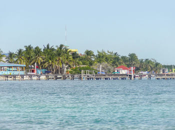 View of swimming pool by sea against sky