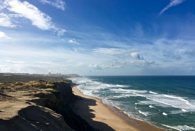 Scenic view of beach against sky