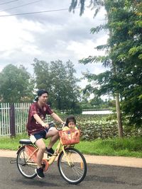 Portrait of woman riding bicycle