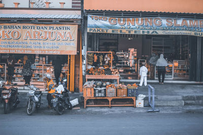 People working on street in city