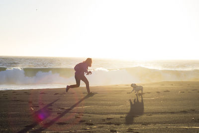 Man on beach against sky