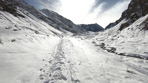 Scenic view of snowcapped mountains against sky