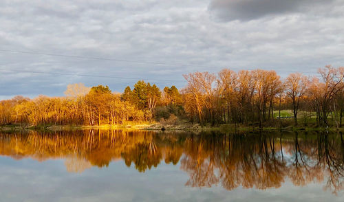 Scenic view of lake against sky during autumn