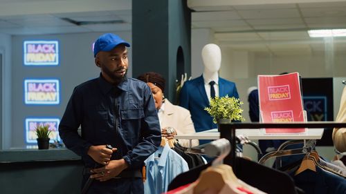 Rear view of man standing in store