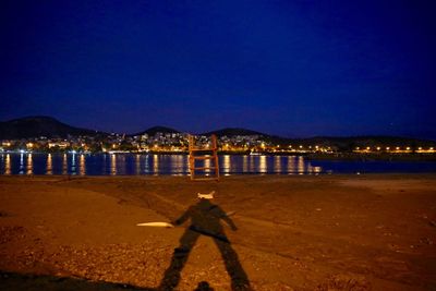 Woman standing at night