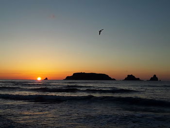 Scenic view of sea against sky during sunset