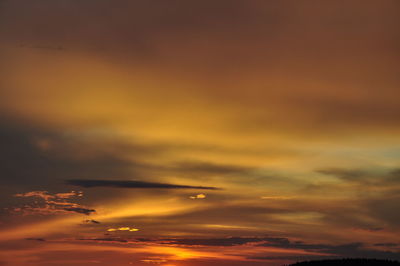 Low angle view of dramatic sky during sunset