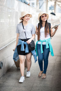 Tourists on footpath in city